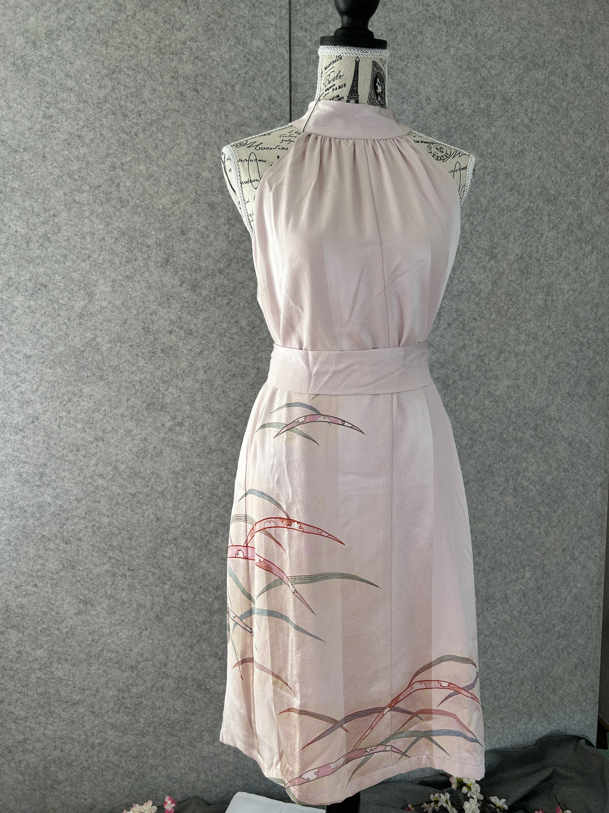 Light pink kimono halter dress belted with sash, front view