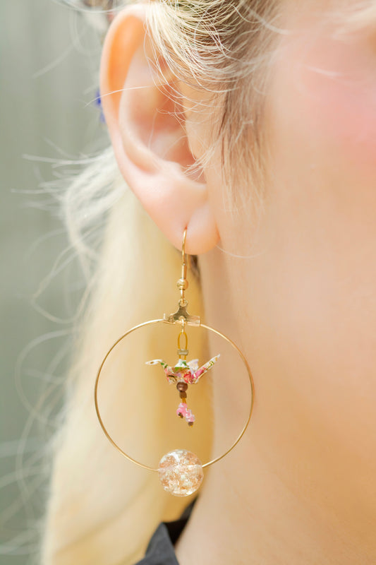 Model wearing the Crane Origami in Creole Earrings