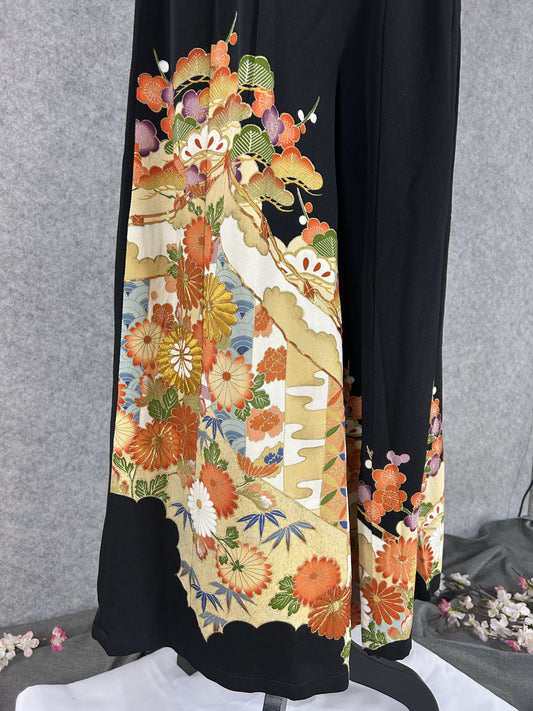 Black upcycled kimono palazzo pants, detail of chrysanthemums, plum blossoms and pine on gold