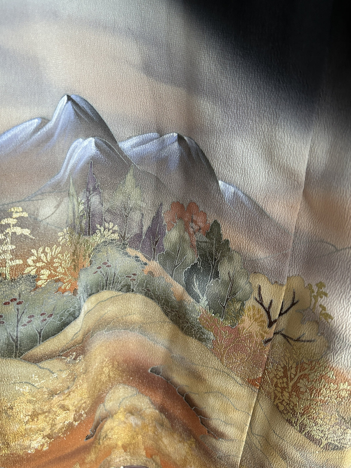 Black kimono wrap skirt, detail of grey-lilac mountain peaks and trees