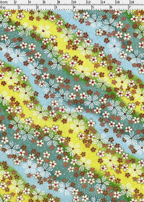 Floral pattern chiyogami paper with red, white, and green flowers on a blue and yellow background.