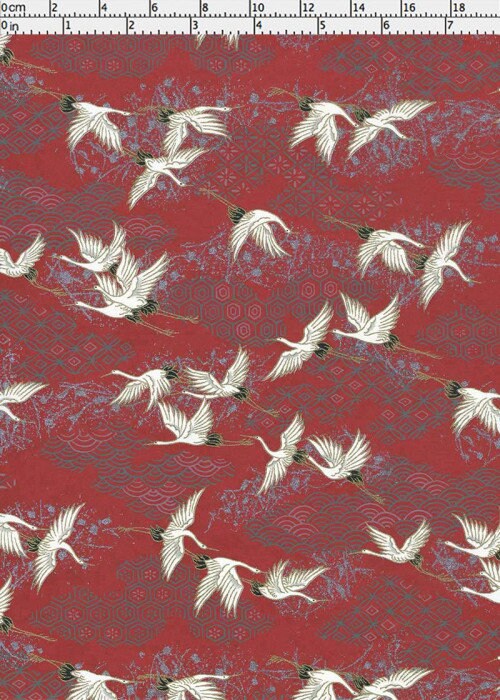 chiyogami paper with white crane pattern on a red background
