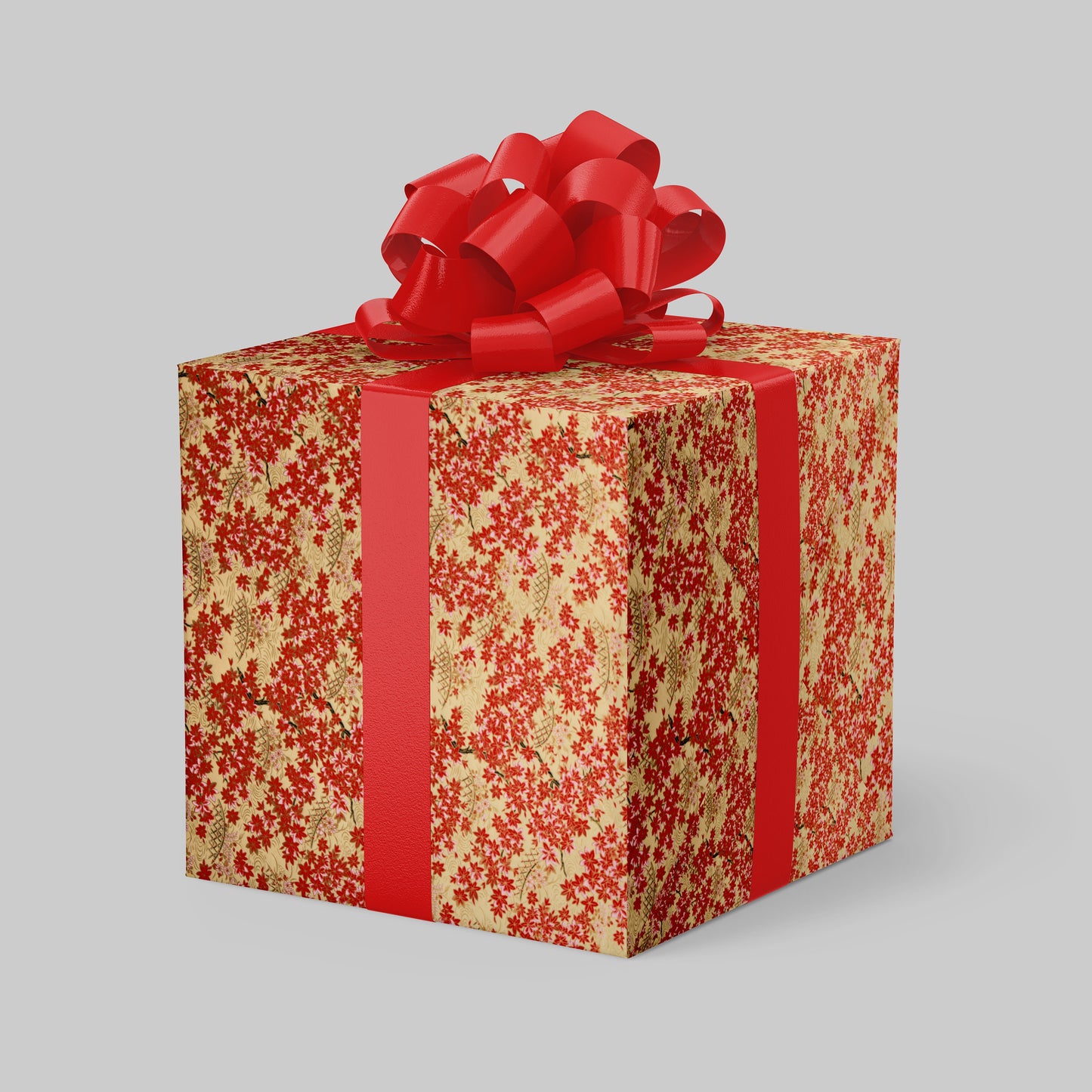 Gift box with red floral pattern and large red bow on a gray background