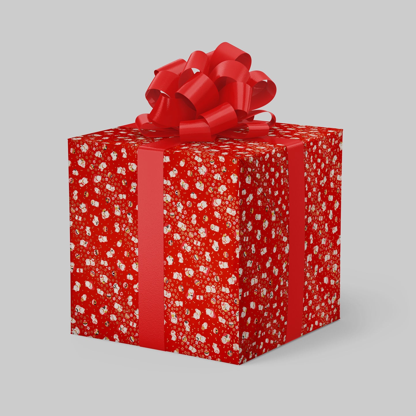 Red gift box with chiyogami paper pattern and a large red bow on a gray background