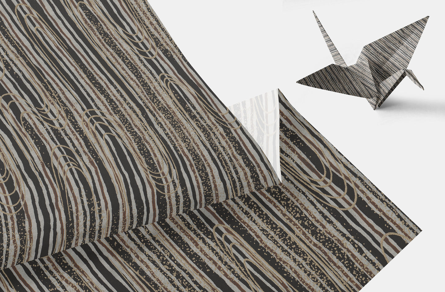 Chiyogami paper with geometric pattern wavy line pattern in brown and beige tone and origami crane on a white background