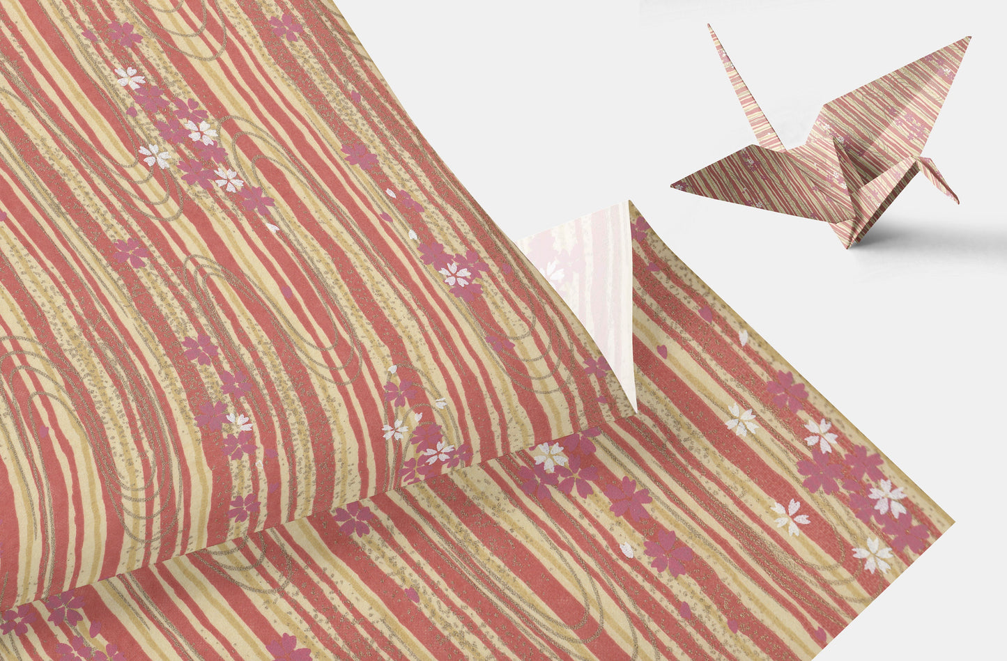 Chiyogami paper with floral pattern and origami crane on a white background