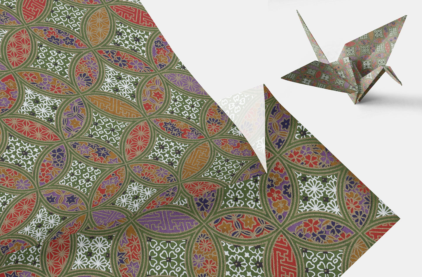 Decorative chiyogami paper with intricate patterns and a folded paper crane on a white background