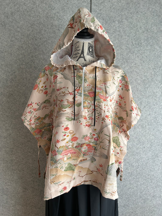 Hooded poncho from a vintage Japanese kimono, cream-pink with a soft rose and green floral pattern, front view