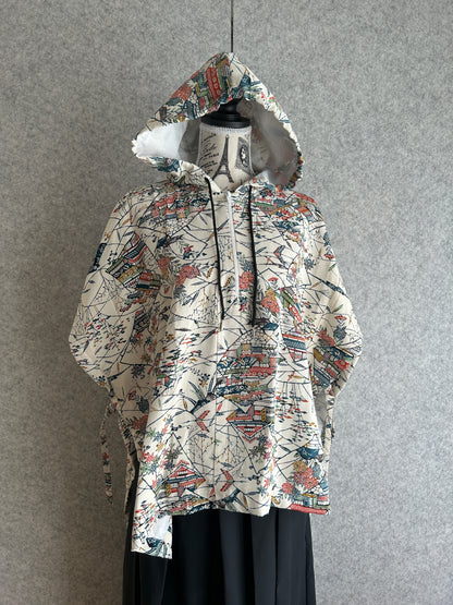 Patterned dress on a mannequin against a gray background