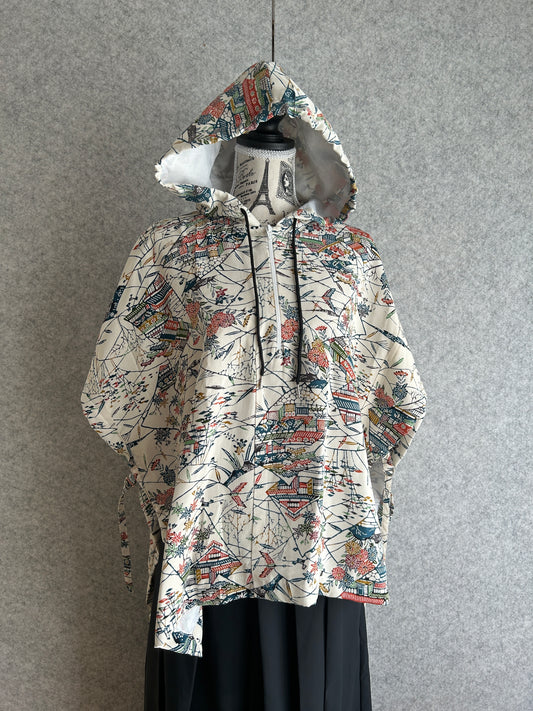 Patterned dress on a mannequin against a gray background