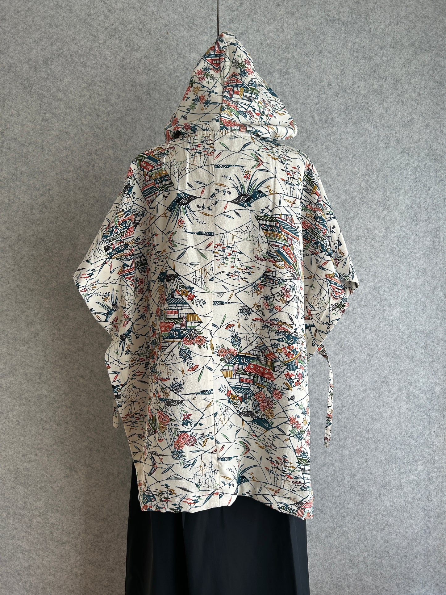 Decorative fabric with intricate patterns on a gray background
