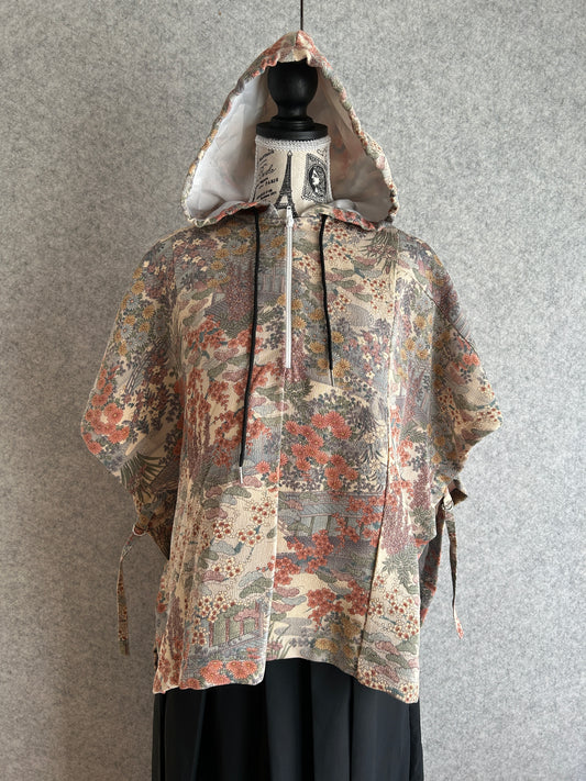 Hooded poncho from a vintage Japanese kimono, beige-pink with a sage and rose garden pattern, front view