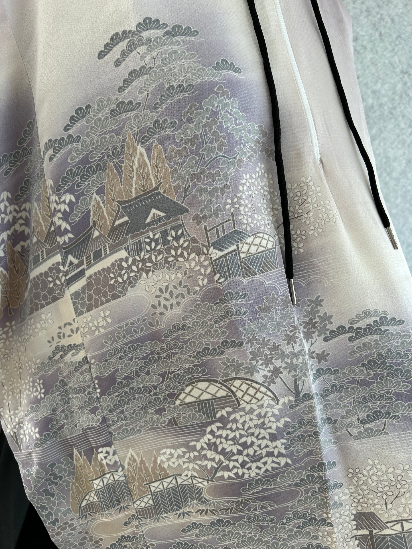 Close-up of a textured fabric with intricate patterns on a light background
