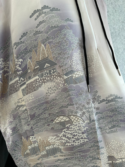 Close-up of a textured fabric with intricate patterns on a light background