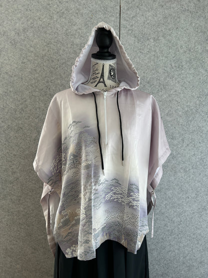 White raincoat with black accents on a gray background