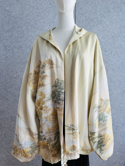 Cream oversized kimono hoodie with gold and green landscape design, front view
