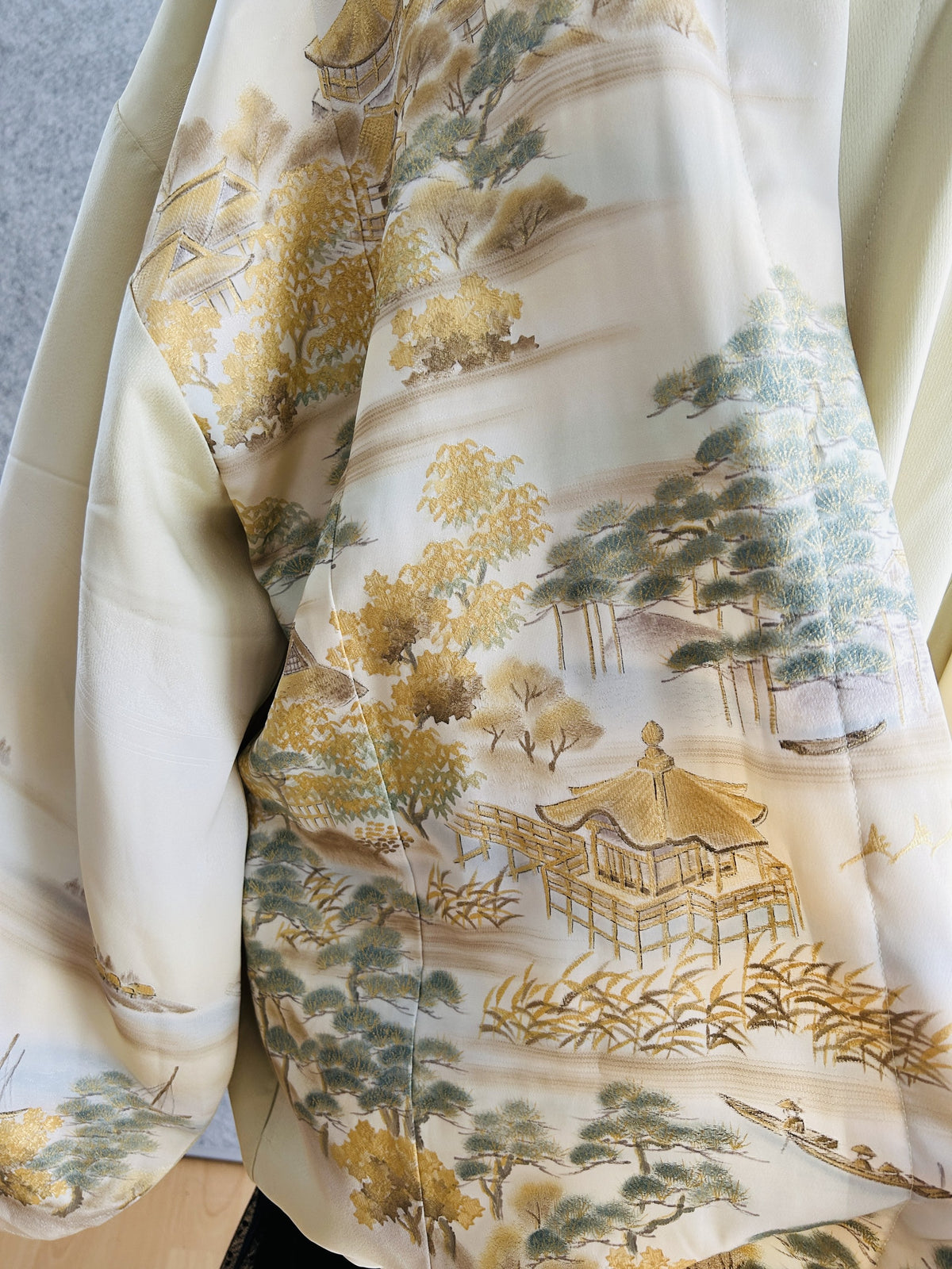 Cream kimono hoodie, detail of gold pavilion, pine trees and boats