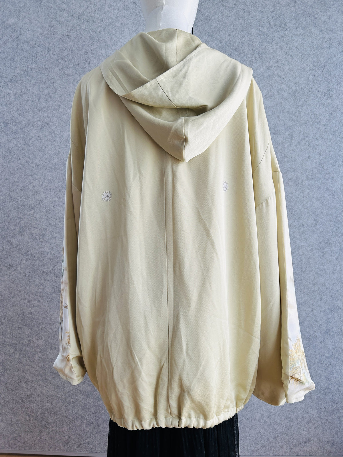 Cream oversized kimono hoodie with hood up and gathered hem, back view
