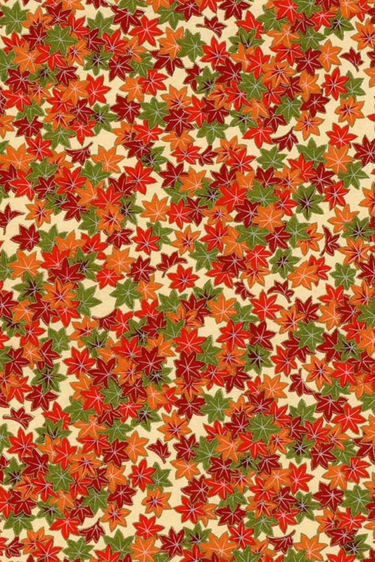 Pattern of autumn leaves in red, orange, and green on a beige background