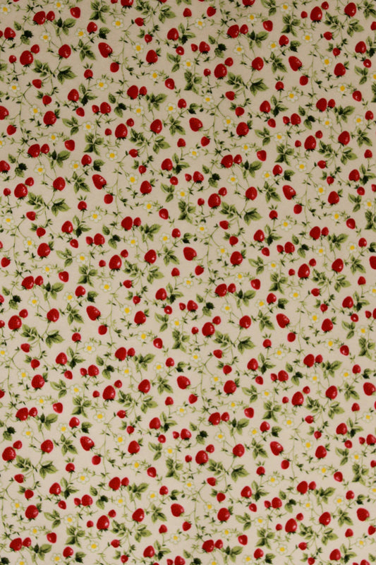 Pattern of red strawberries and green leaves on a beige background