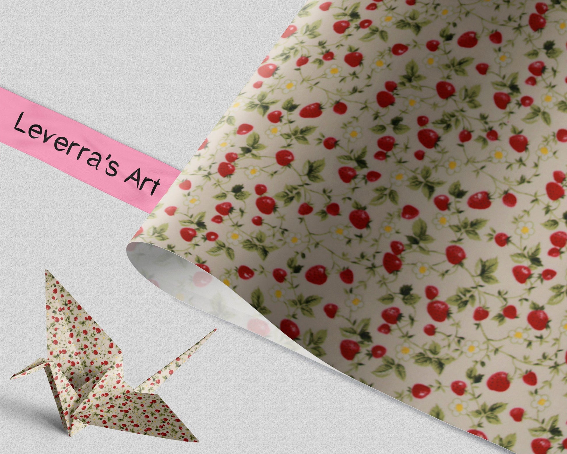 Pattern of red strawberries and green leaves on a beige background with a folded crane of the same paper