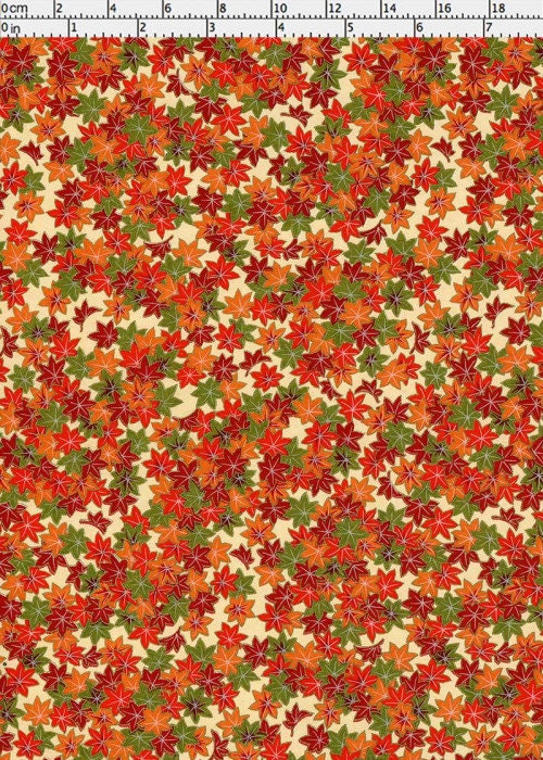 Pattern of autumn leaves in red, orange, and green on a beige background