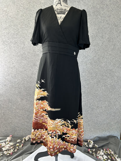 Black empire cut kimono dress with flutter sleeves and crane hem scene, front view
