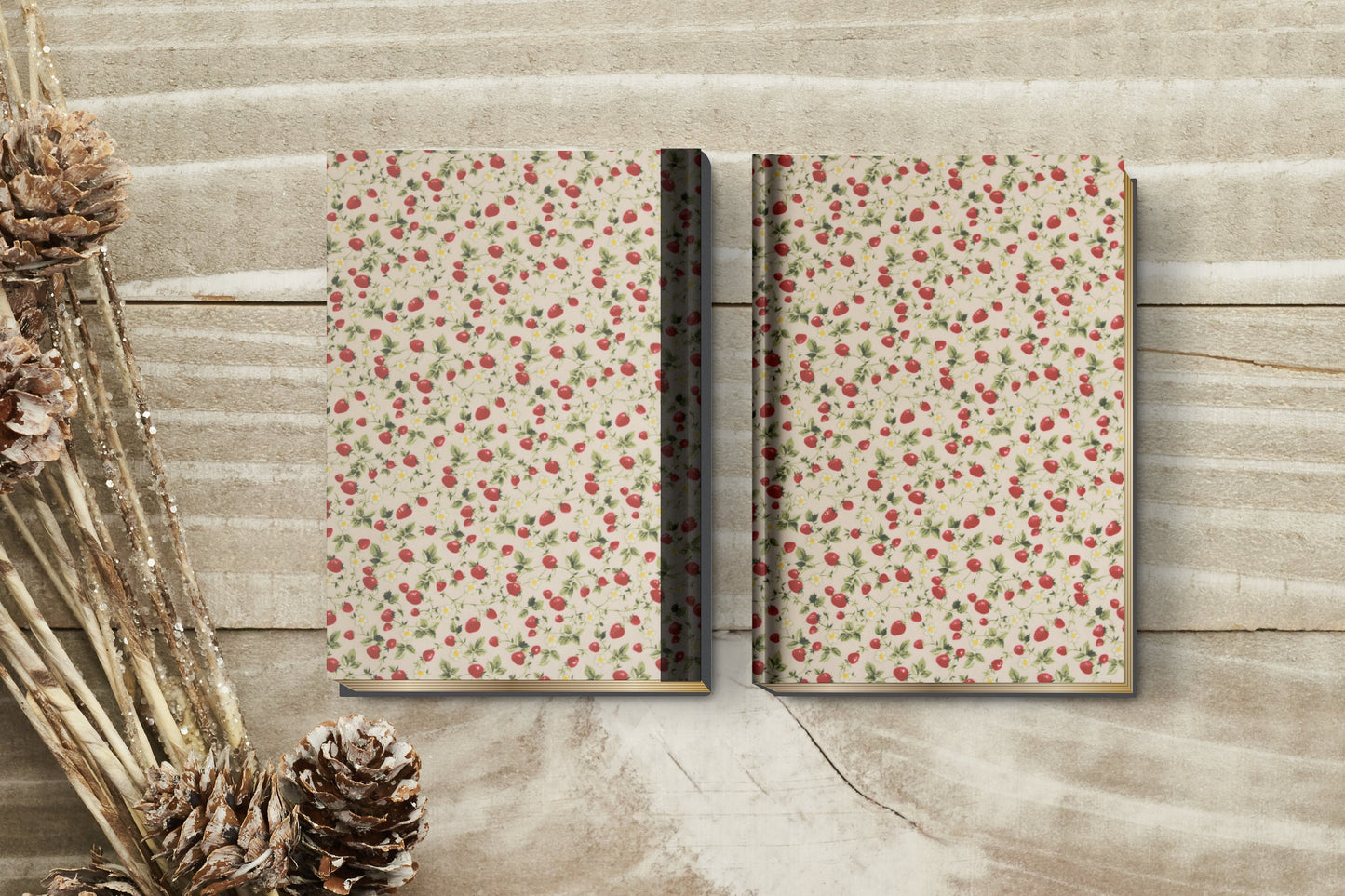 Pattern of red strawberries and green leaves on a beige background used as bookbinding