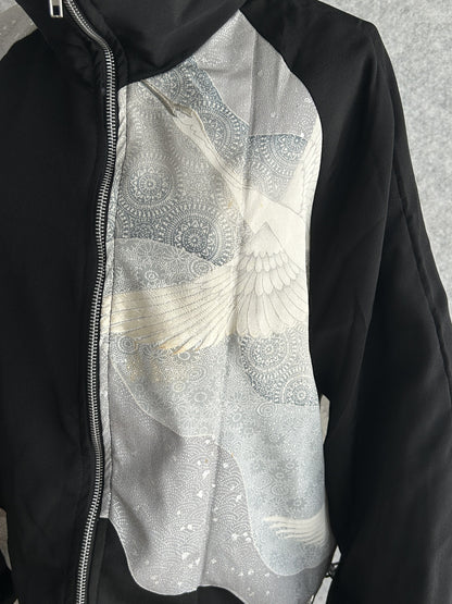 Black high collar kimono jacket, detail of grey front panel with white bird