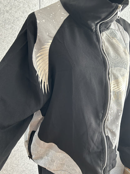 Black high collar kimono jacket, angled front view showing zipper and side pocket