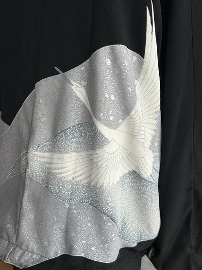 Black high collar kimono jacket, detail of white flying bird on back