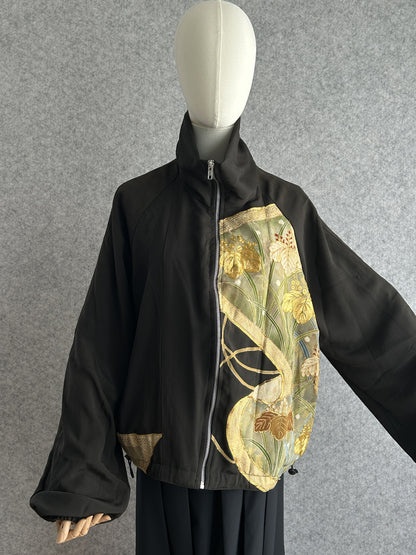 Black high collar kimono jacket with gold and green leaf panel, front view
