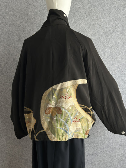 Black high collar kimono jacket with gold and green leaf panel, back view