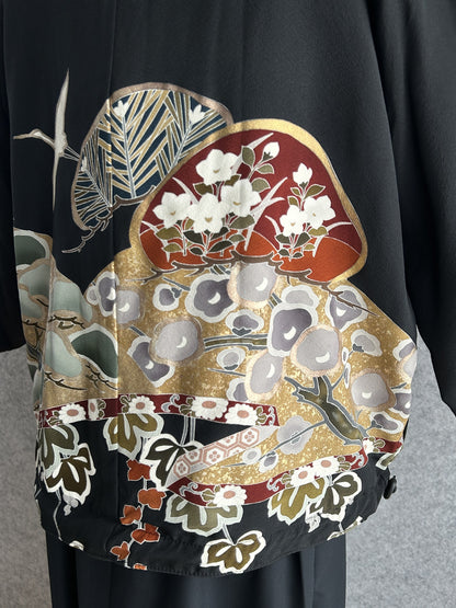 Black high collar kimono jacket, detail of fans and blossoms on back