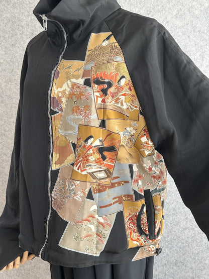 Black high collar kimono jacket, angled front detail of picture card panel