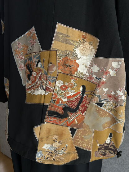 Black high collar kimono jacket, detail of robed figures and flowers on back