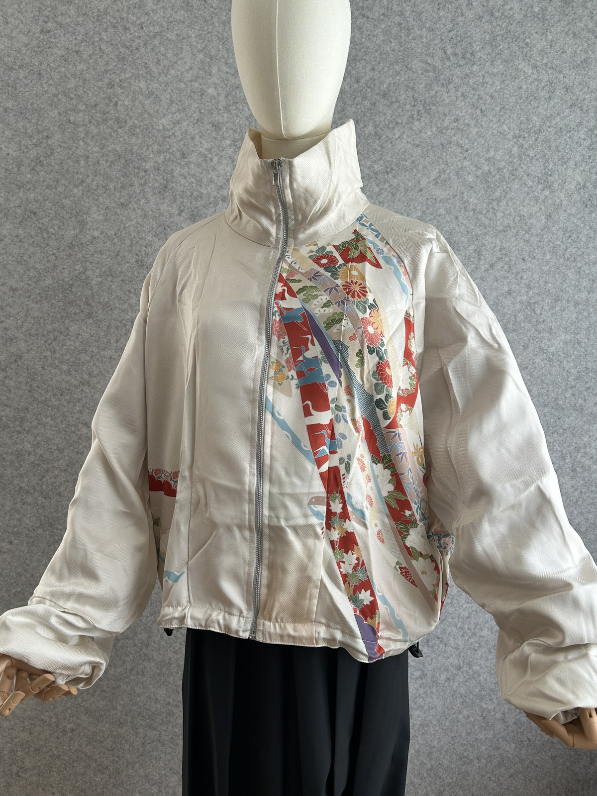 White high collar kimono jacket with red and blue floral ribbon design, front view