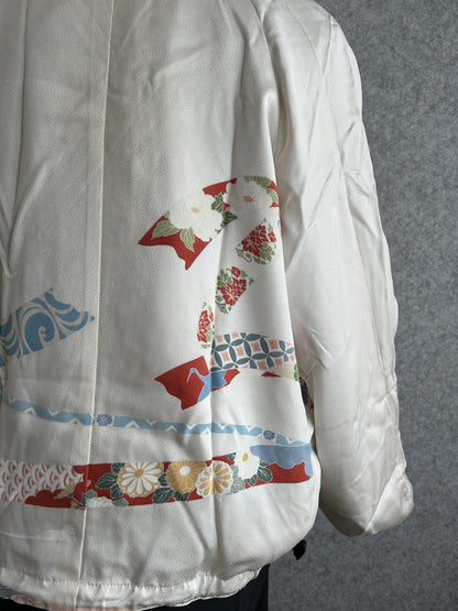 White high collar kimono jacket, detail of floral ribbon bands on back