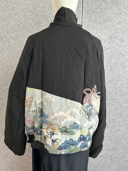 Black high collar kimono jacket with pale blue scenic panel, back view