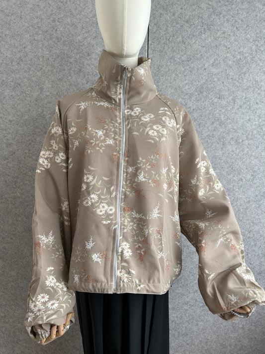Taupe high collar kimono jacket with small white flower pattern, front view