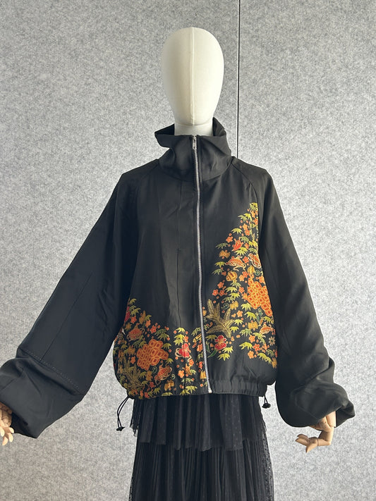Black high collar kimono jacket with floral band, front view