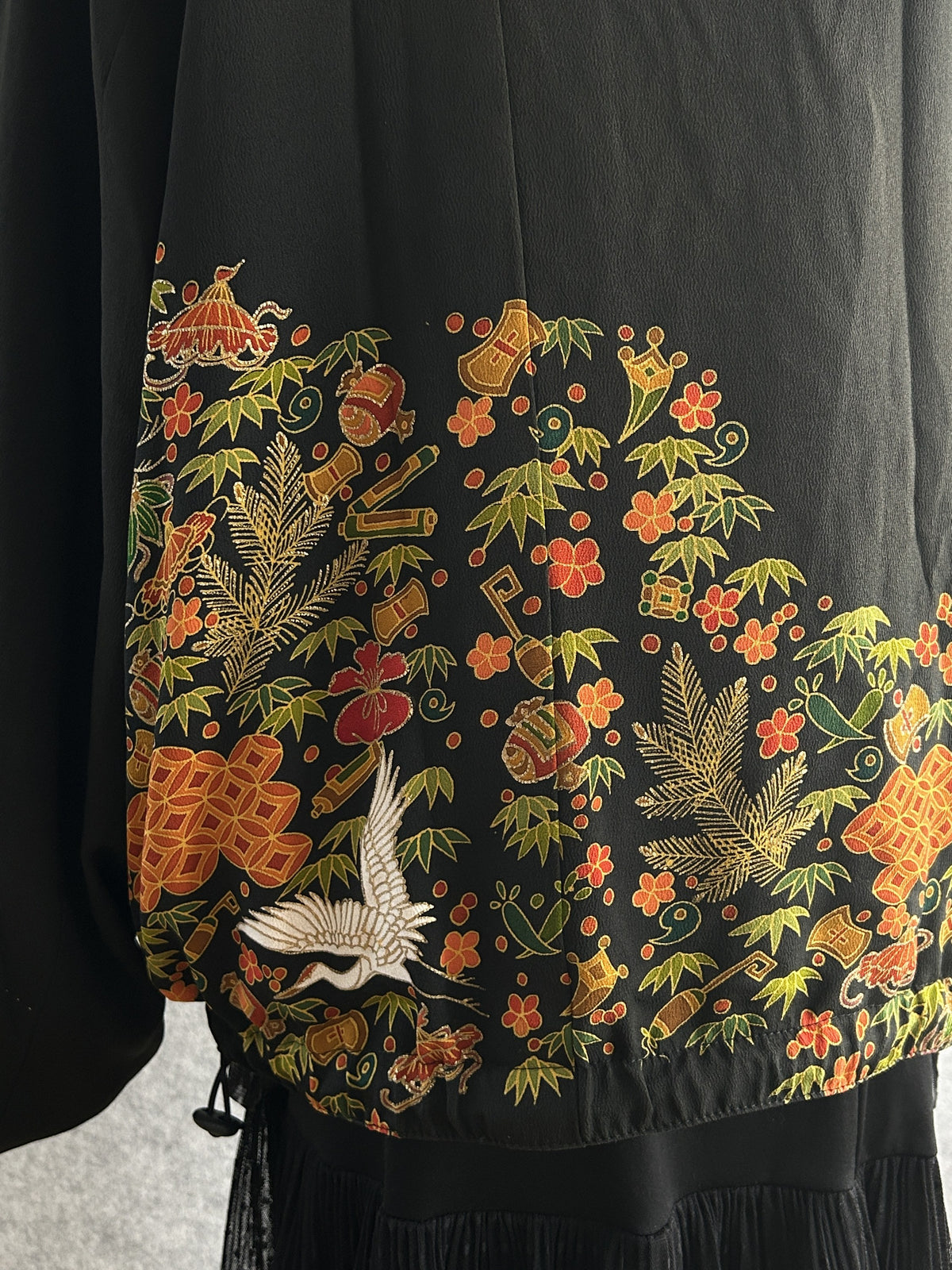 Black high collar kimono jacket with floral band, back detail with floral band and white crane