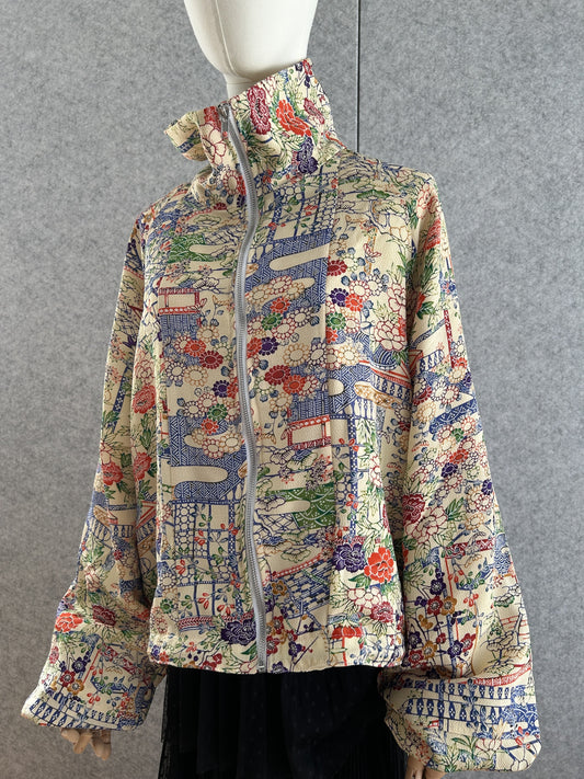 Cream high collar kimono jacket with colourful flowers, front view