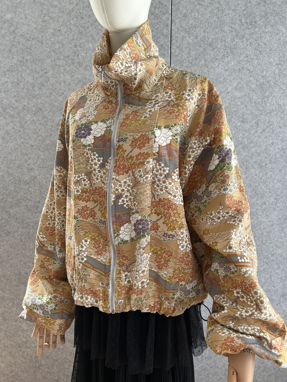 Golden beige high collar kimono jacket with blossoms, front view