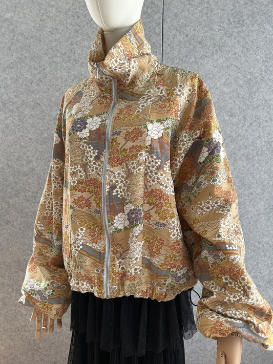 Golden beige high collar kimono jacket with blossoms, front view