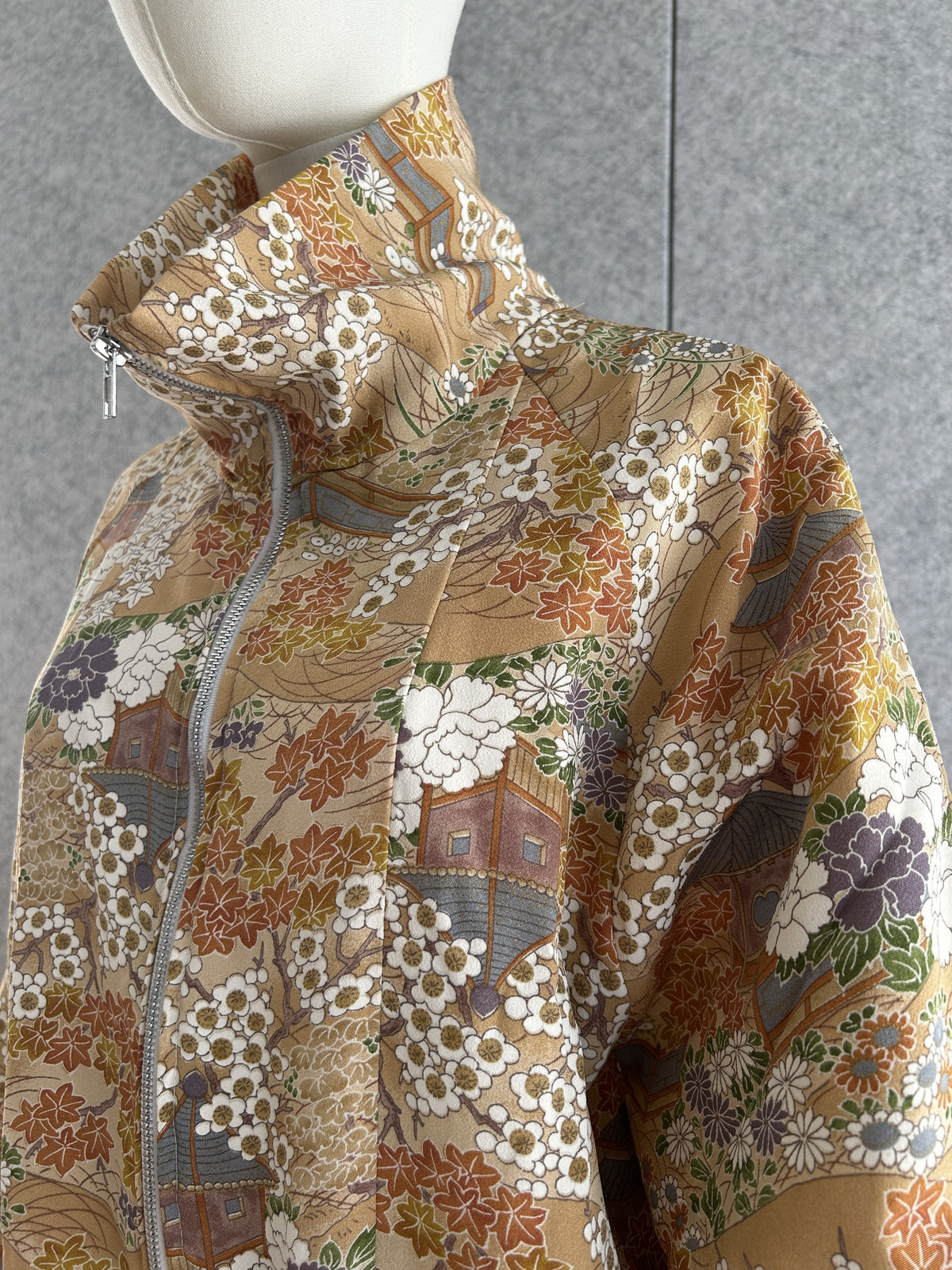 Golden beige high collar kimono jacket with blossoms, detail of collar and shoulder