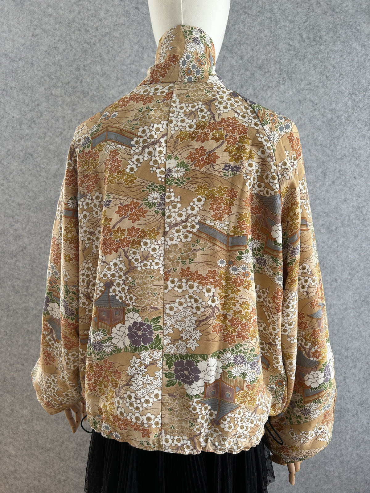 Golden beige high collar kimono jacket with blossoms, back view