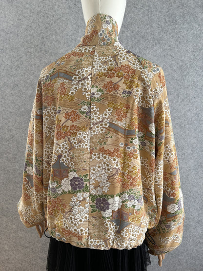 Golden beige high collar kimono jacket with blossoms, back view