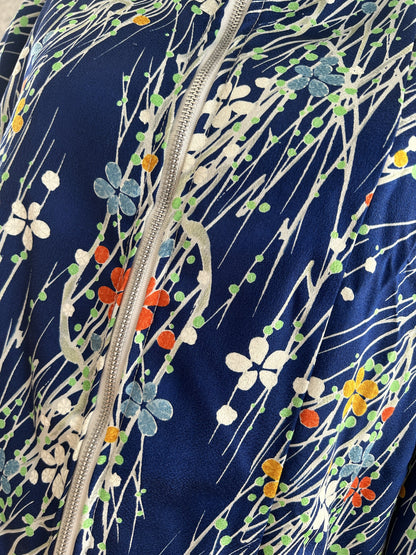 Royal blue high collar kimono jacket with small flowers, detail of flowers and zipper