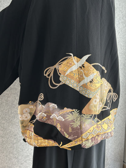 Black high collar kimono jacket with gold crane motifs, back detail with cranes and cords